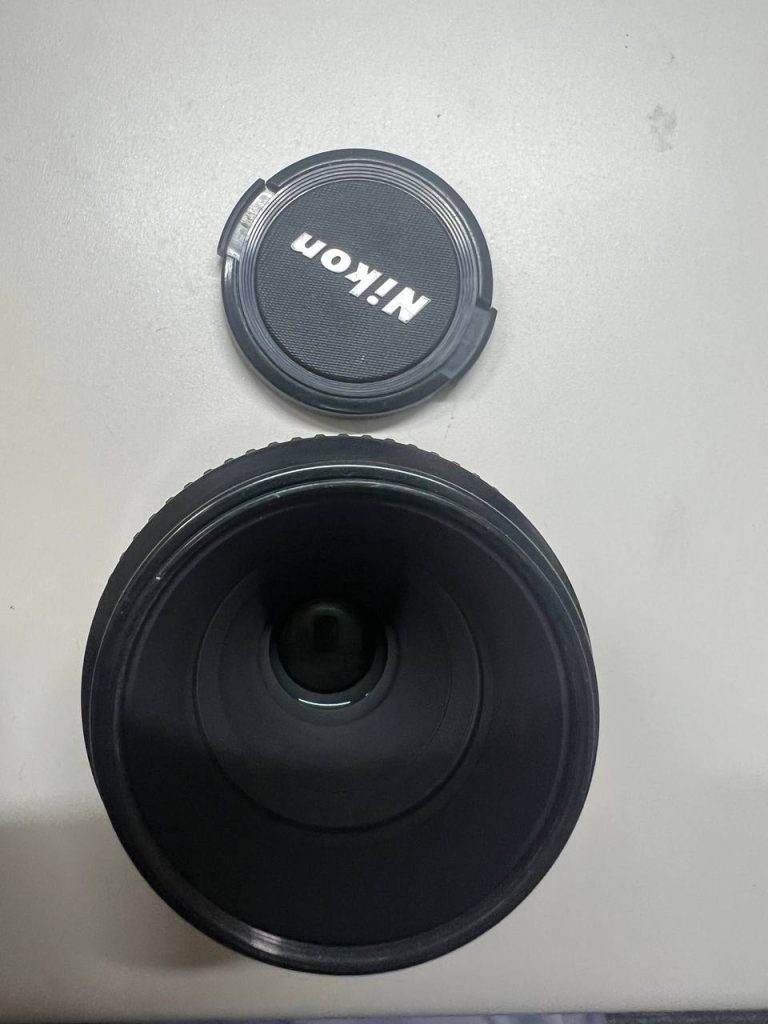 日本代购代拍到货镜头开箱,附带 Nikon 镜头盖的俯拍实物图